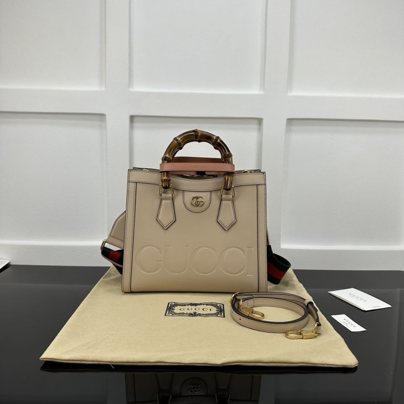 G*u*i top handle bags